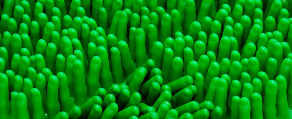 Green plastic-looking finger-like material