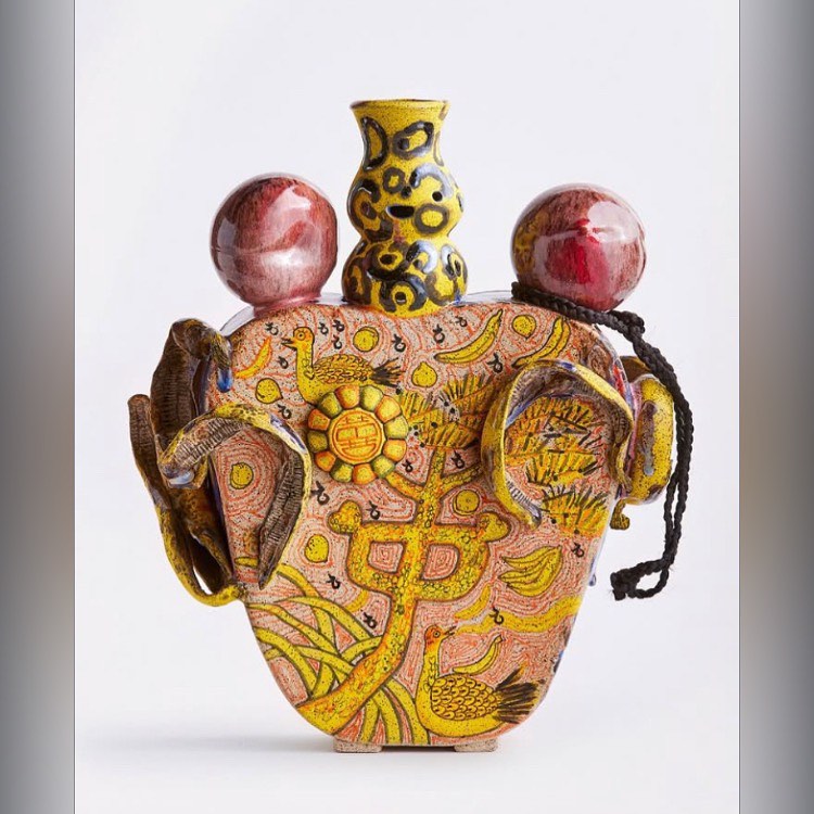 there is a vase that is sitting on top of a bag