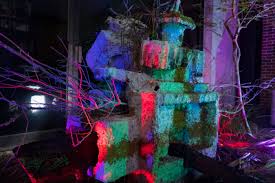 there is a lighted cake that is sitting on the ground