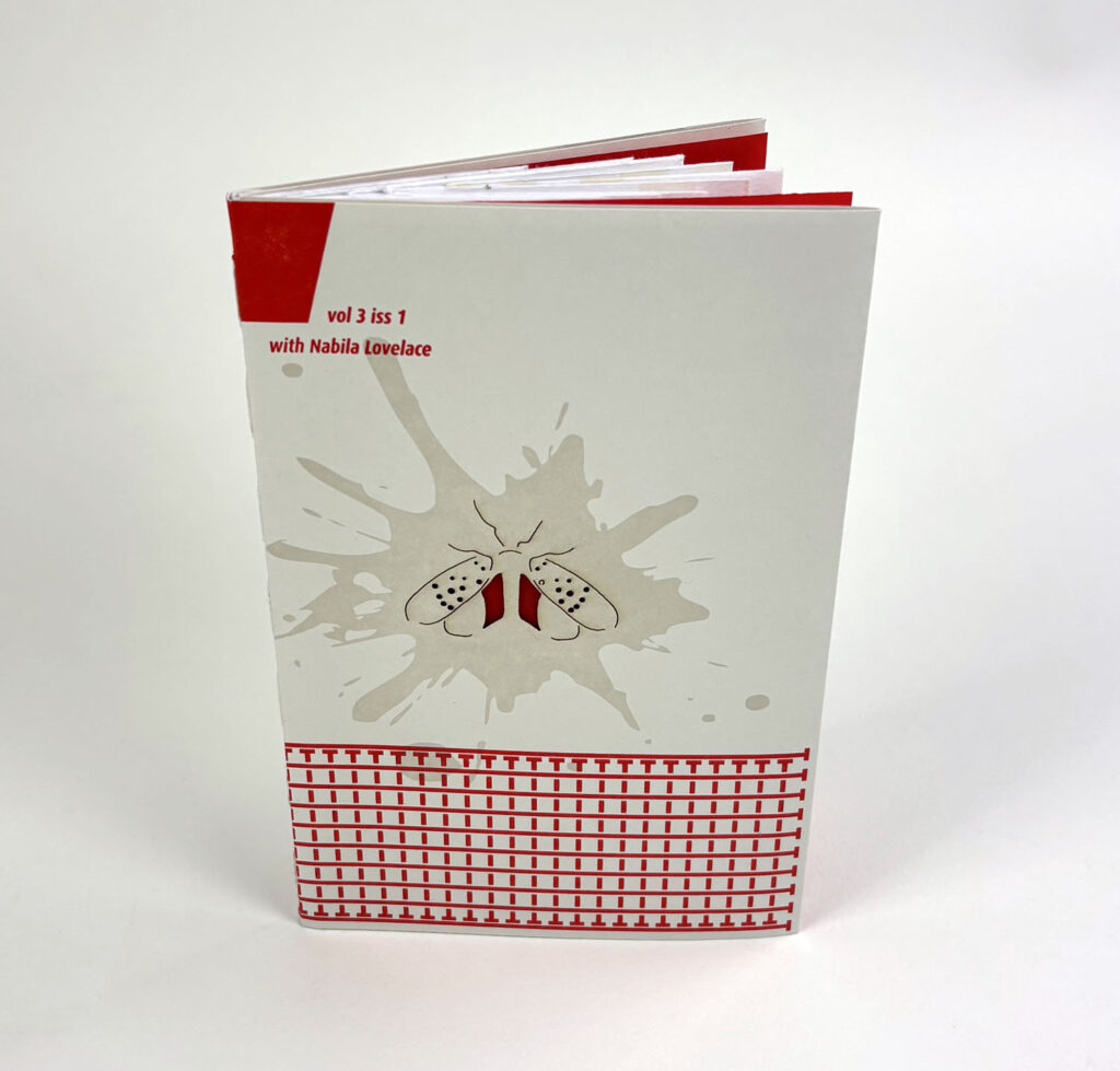 there is a red and white book with a picture of a dog on it