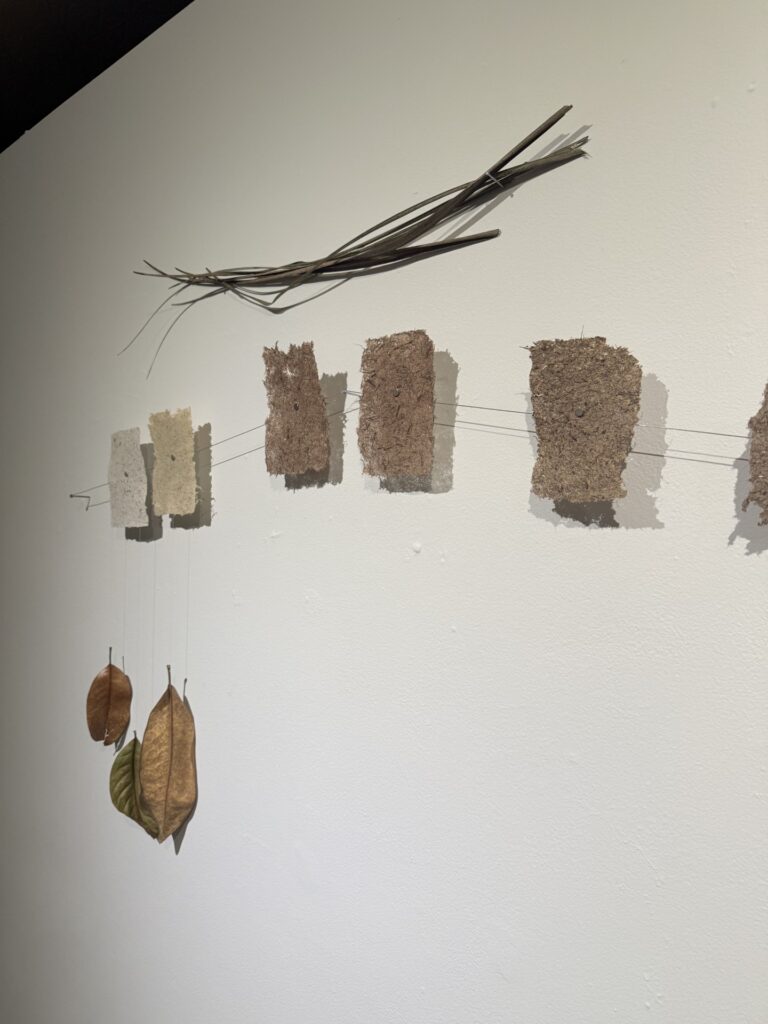there are several pieces of paper hanging on the wall