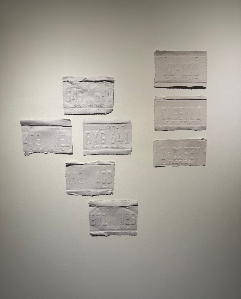several pieces of paper taped to a wall with words written on them