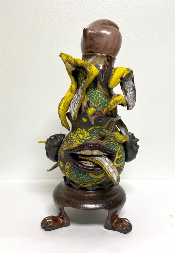 there is a figurine of a man riding a dragon with bananas on his head