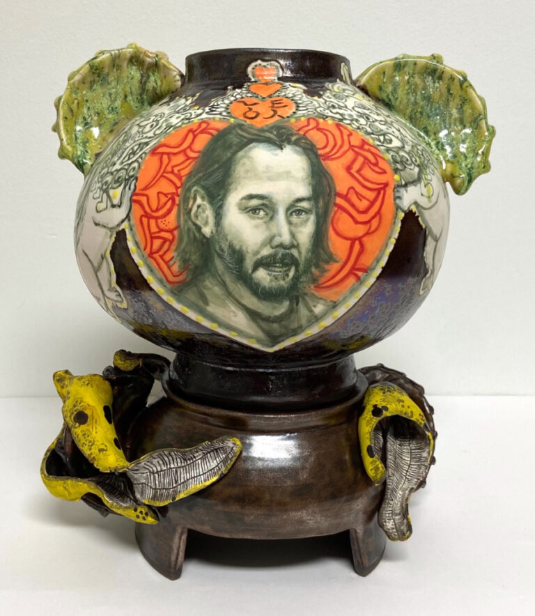 there is a vase with a picture of a man on it