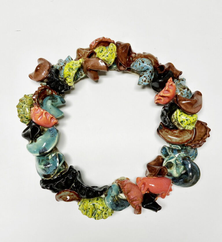this is a picture of a bracelet made out of ceramic animals