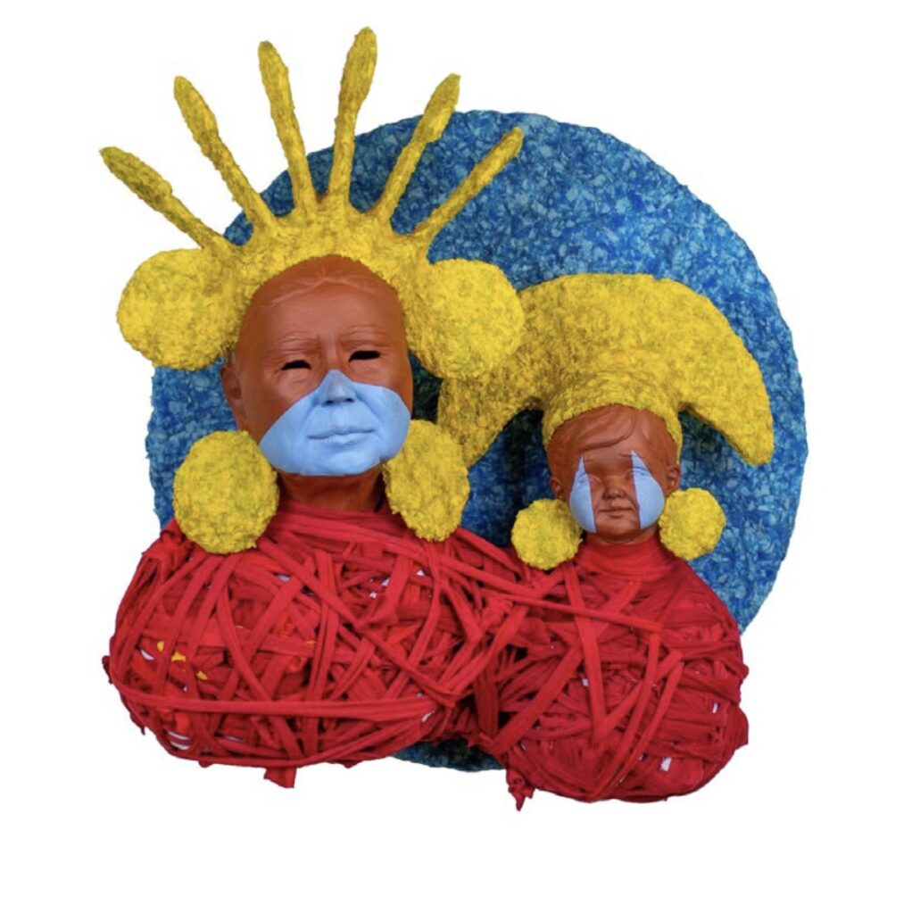 there is a sculpture of a woman with yellow hair and a blue face
