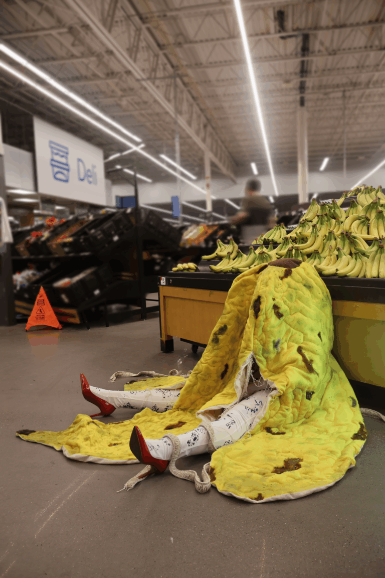 there is a pile of bananas sitting on the floor in a store