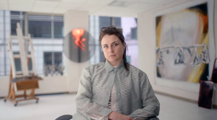 there is a woman that is sitting in a chair in a room
