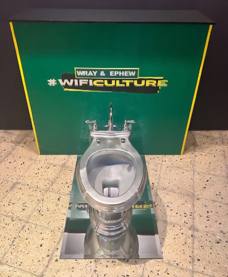 there is a metal toilet with a green box behind it