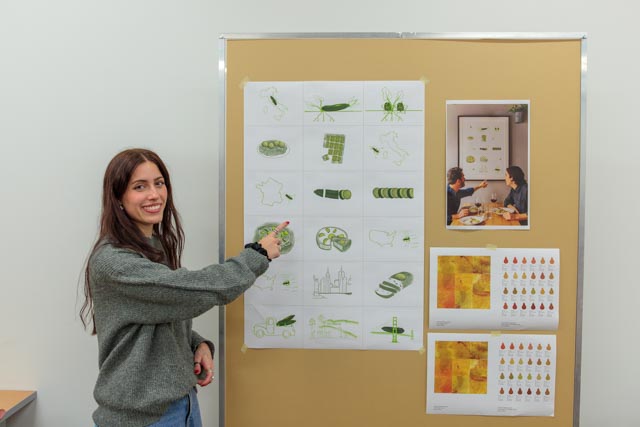 A student pointing at a poster